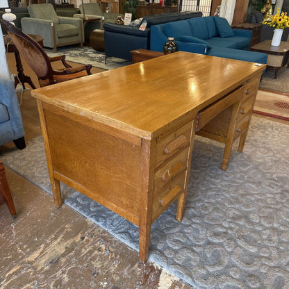 Wooden desk in a room with furniture and decor