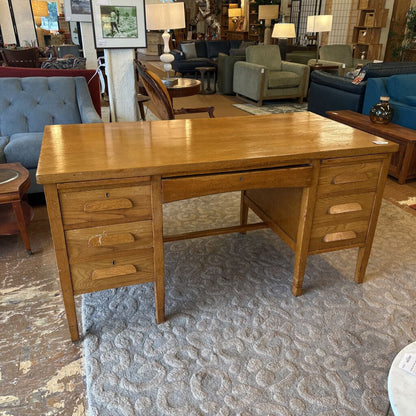 Wooden desk in a room with furniture and decor