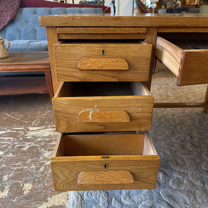 Wooden dresser with open drawers in a room setting