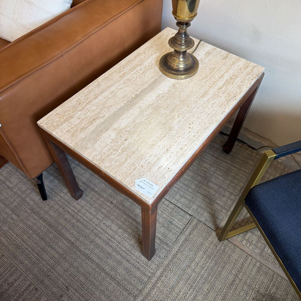 Small table with marble top and brass lamp in a room setting