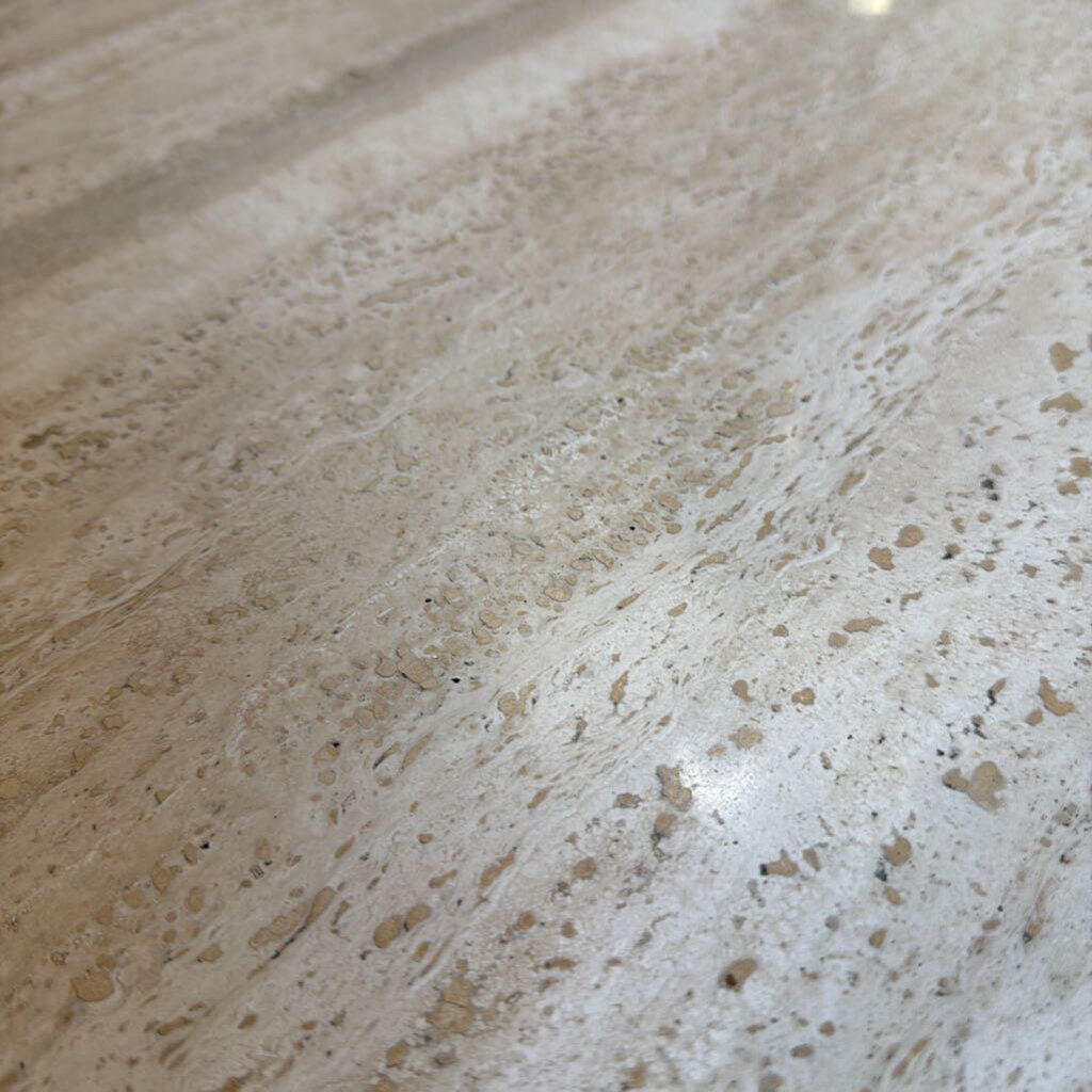 Close-up of a marble countertop with beige and white patterns