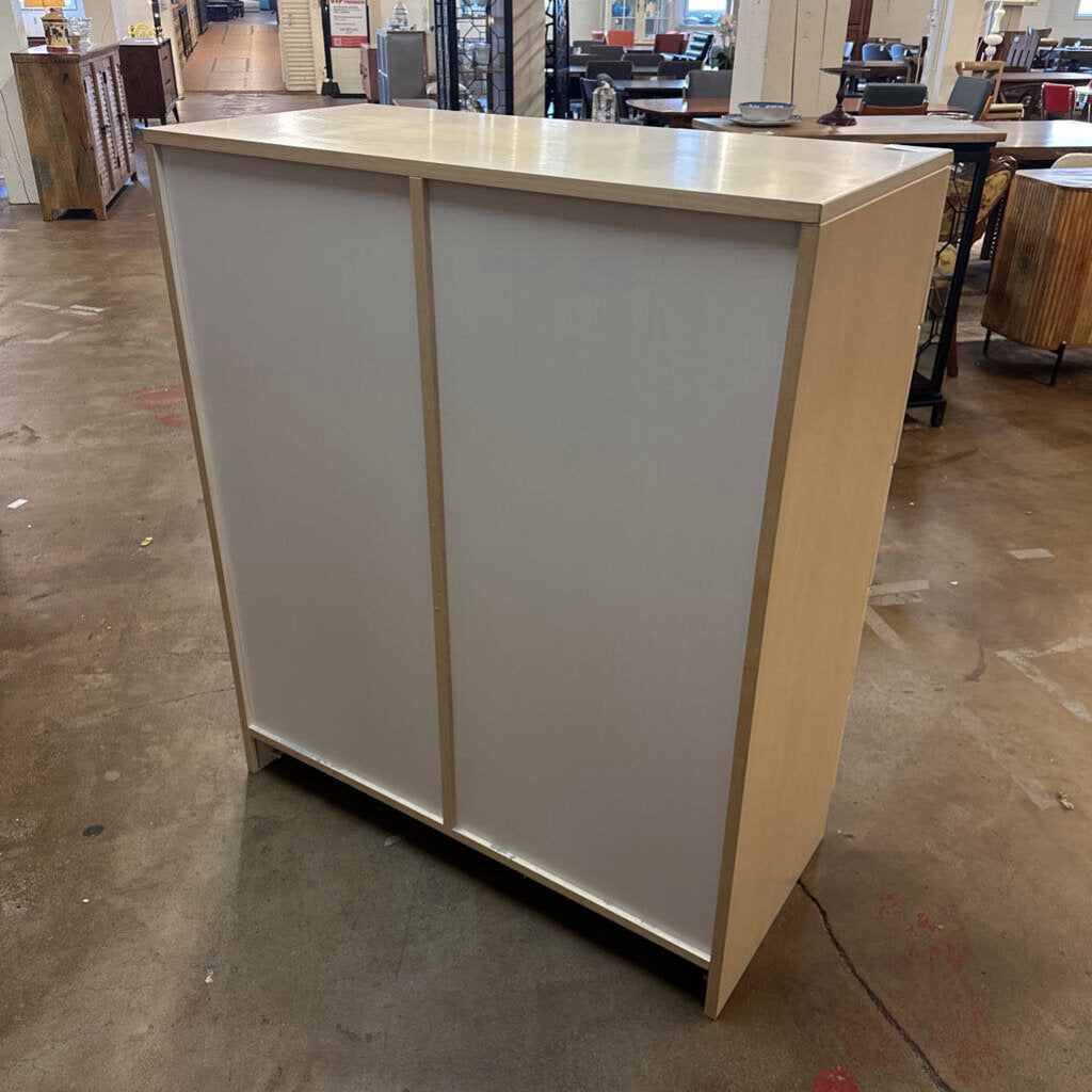 Beige and white reception desk in a warehouse setting