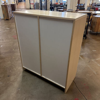 Beige and white reception desk in a warehouse setting
