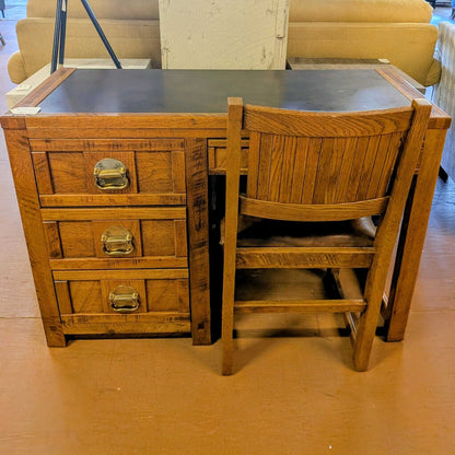 Wooden desk with chair in a room setting