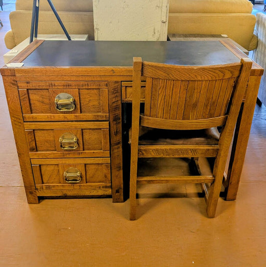 Wooden desk with chair in a room setting