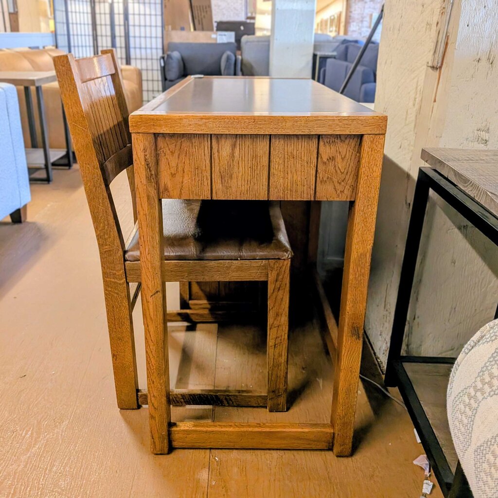 Wooden dining table with chairs in a showroom setting