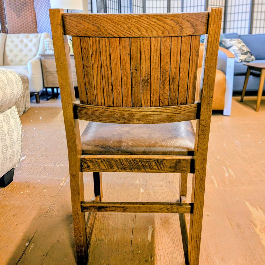 Wooden chair in a room with furniture in the background