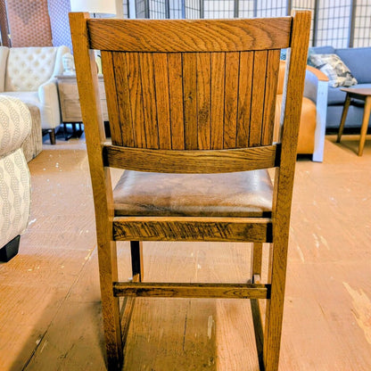 Wooden chair in a room with furniture in the background