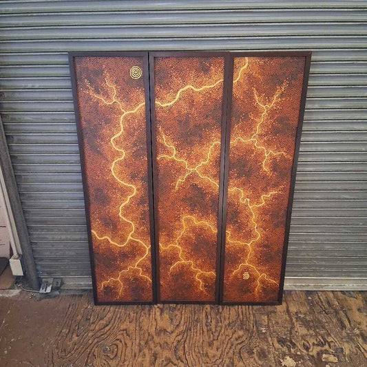 Three rusted metal panels with lightning design against a corrugated metal background