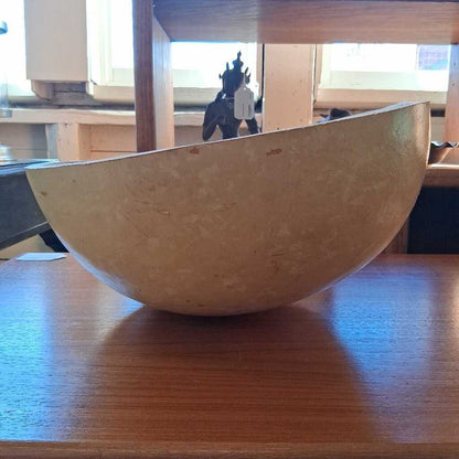 Wooden bowl on a wooden table with a blurred background