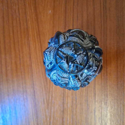 Decorative metal knob on a wooden door