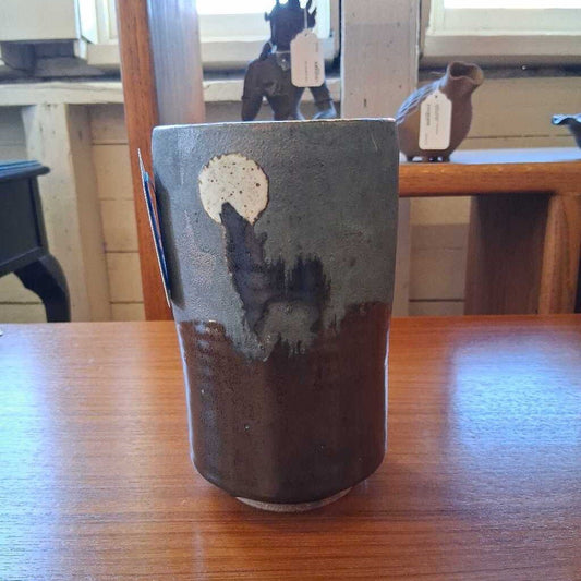 Ceramic cup with abstract design on a wooden table