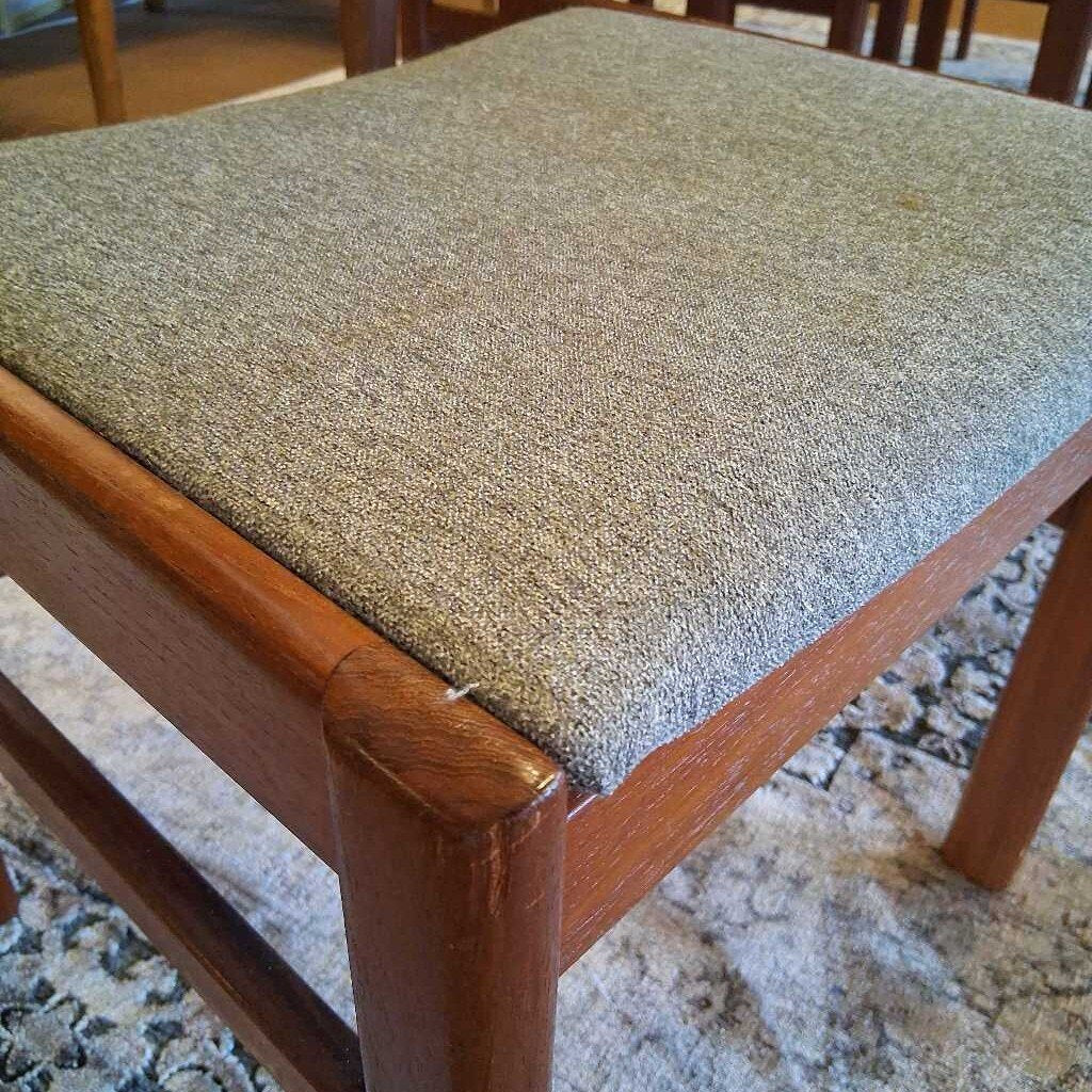Wooden chair with a textured cushion on a patterned rug