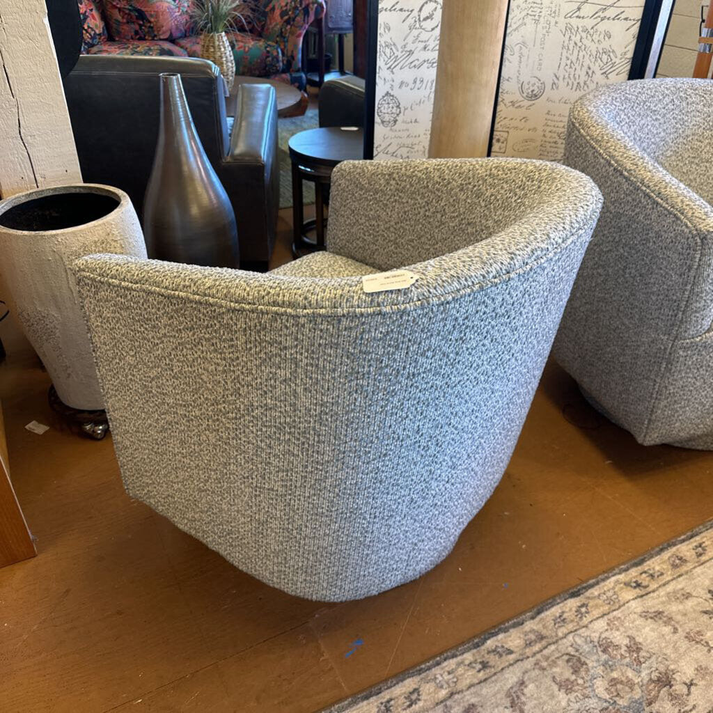 Gray textured armchair in a room with decorative elements