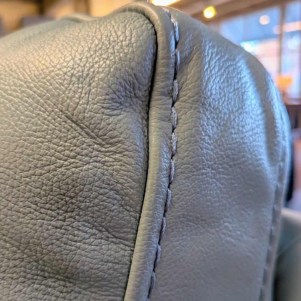 Close-up of gray leather with stitching detail