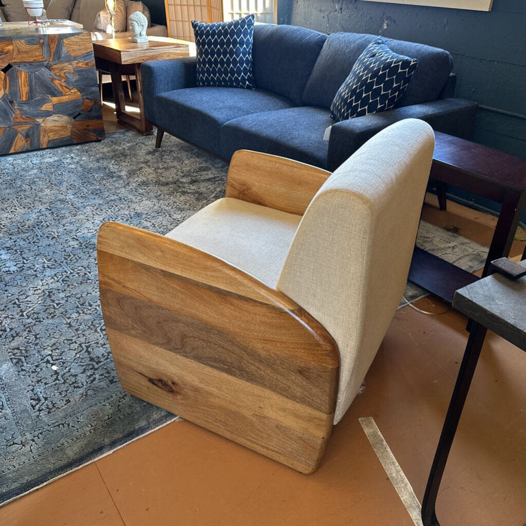 Wooden armchair with beige cushion in a living room setting