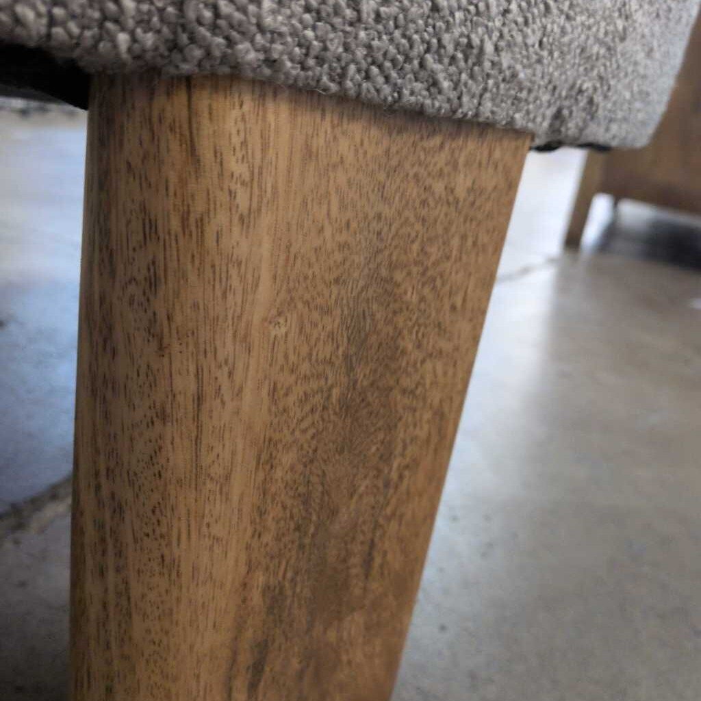 Close-up of a wooden leg with a textured surface