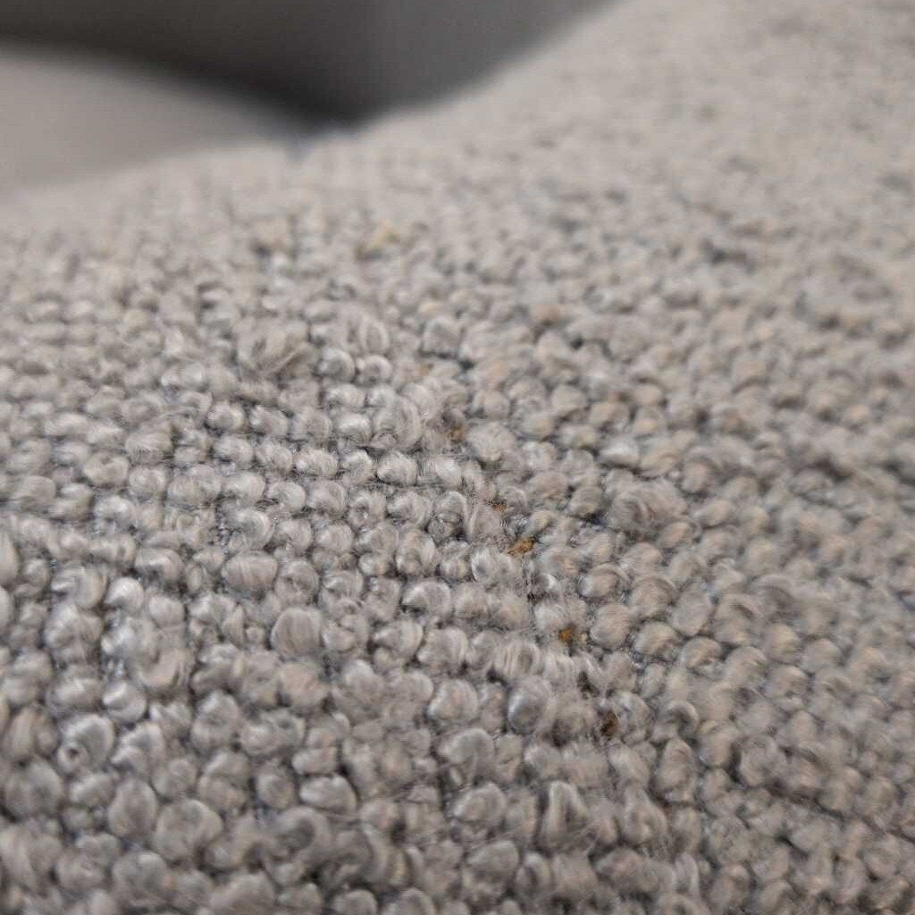 Close-up of textured gray carpet