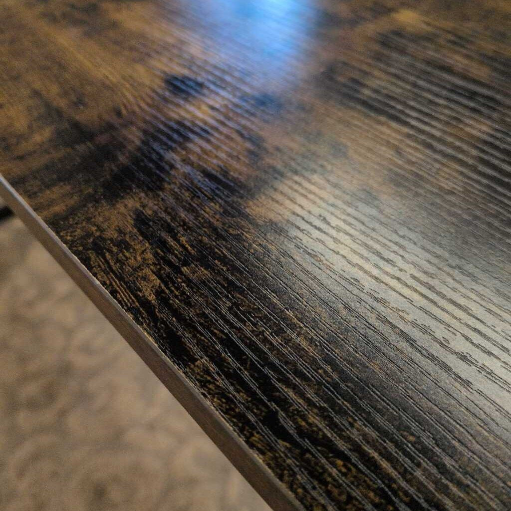 Close-up of a wooden surface with visible grain and texture