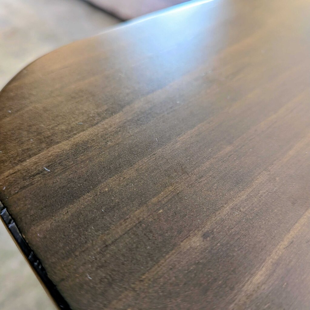 Close-up of a wooden surface with visible grain and texture