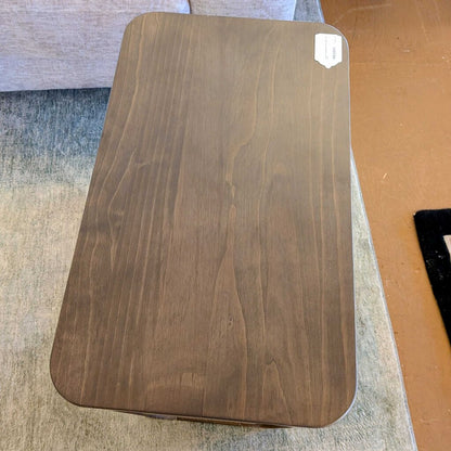Wooden cutting board on a surface