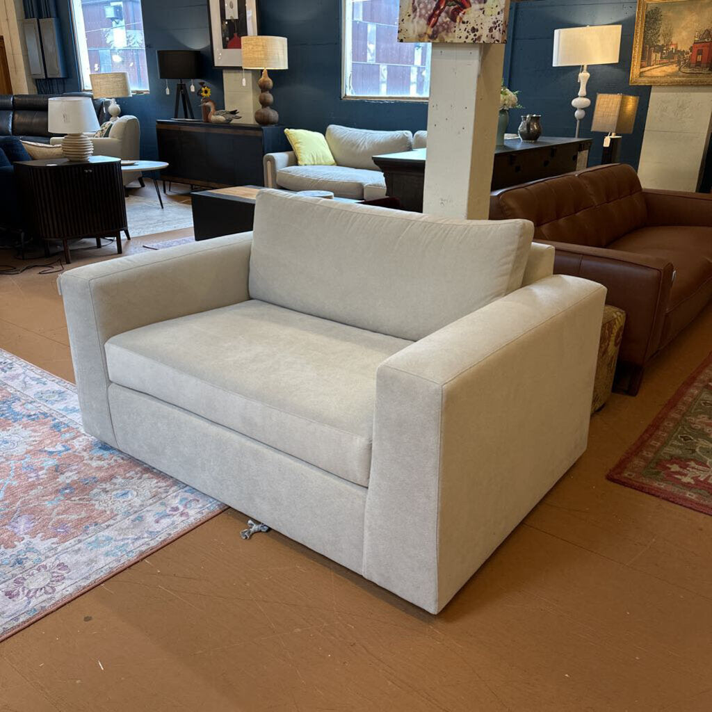 Light gray sofa in a room with other furniture and decor