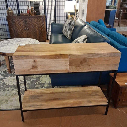 Wooden console table with a shelf in a living room setting
