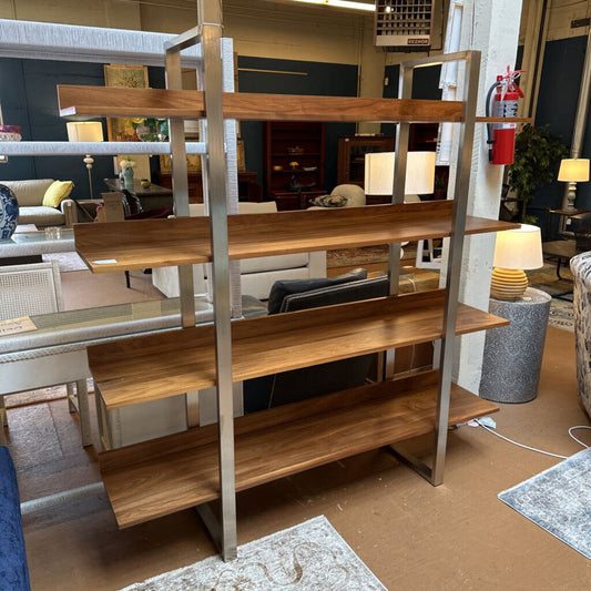 Wooden shelf with metal legs in a room setting