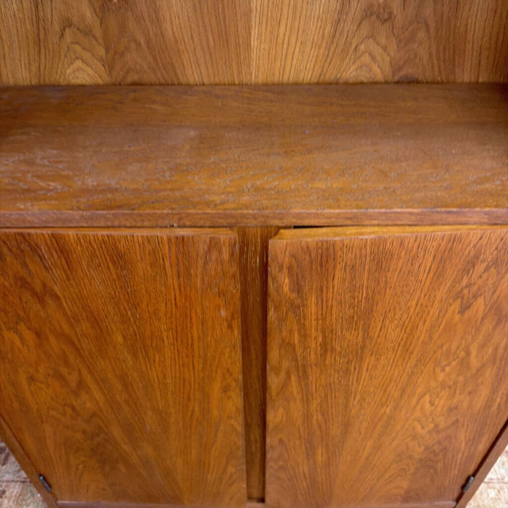 Close-up of a wooden cabinet with a focus on texture and color.