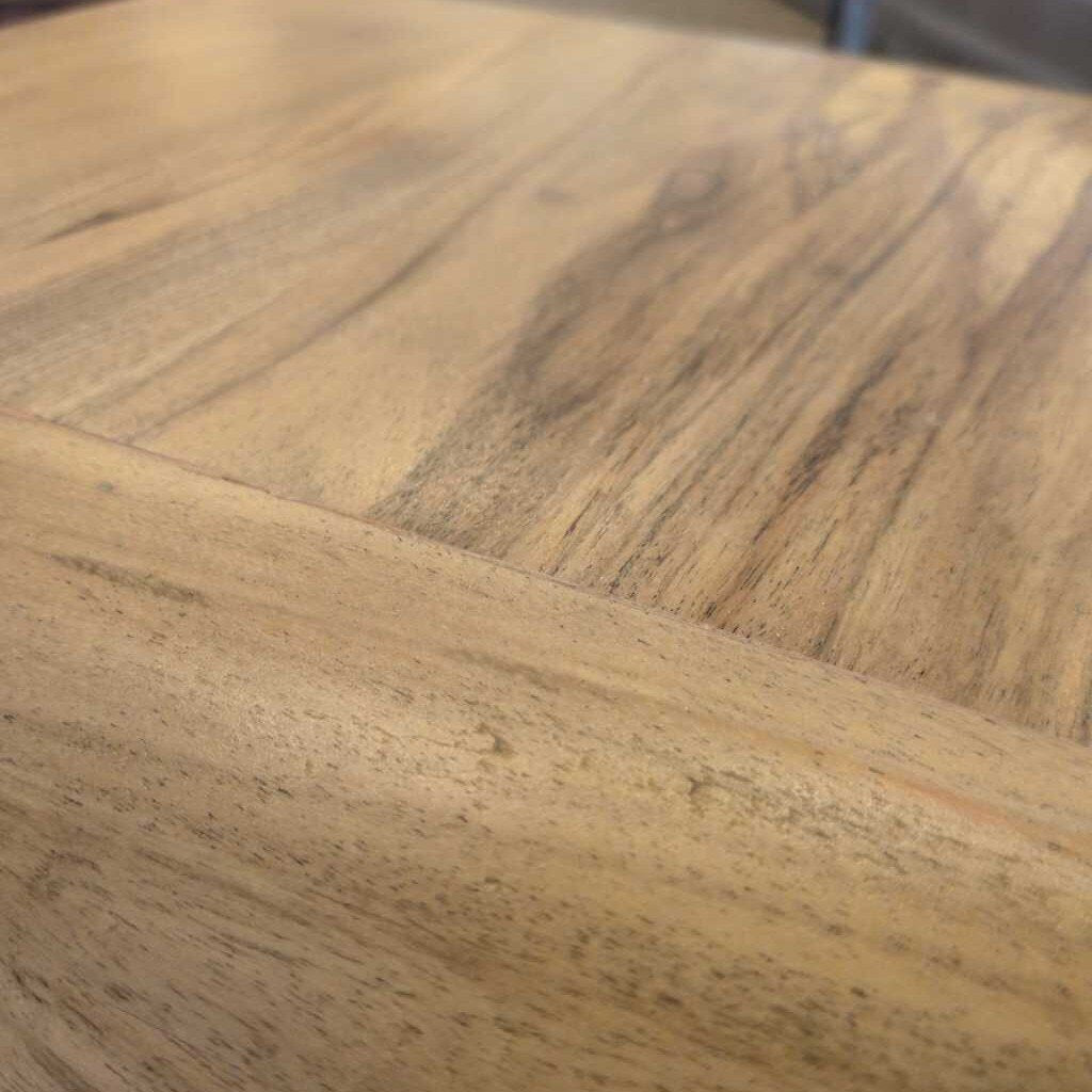Close-up of a wooden surface with visible grain and texture