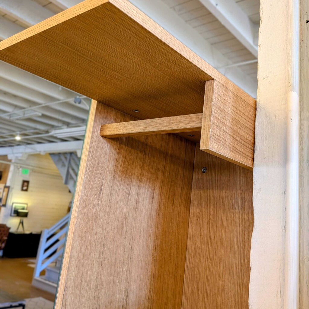 Wooden shelf with a blurred indoor background