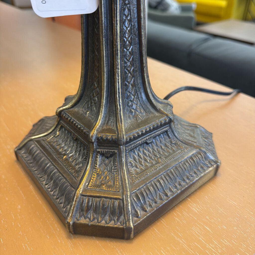 Decorative lamp base on a wooden surface