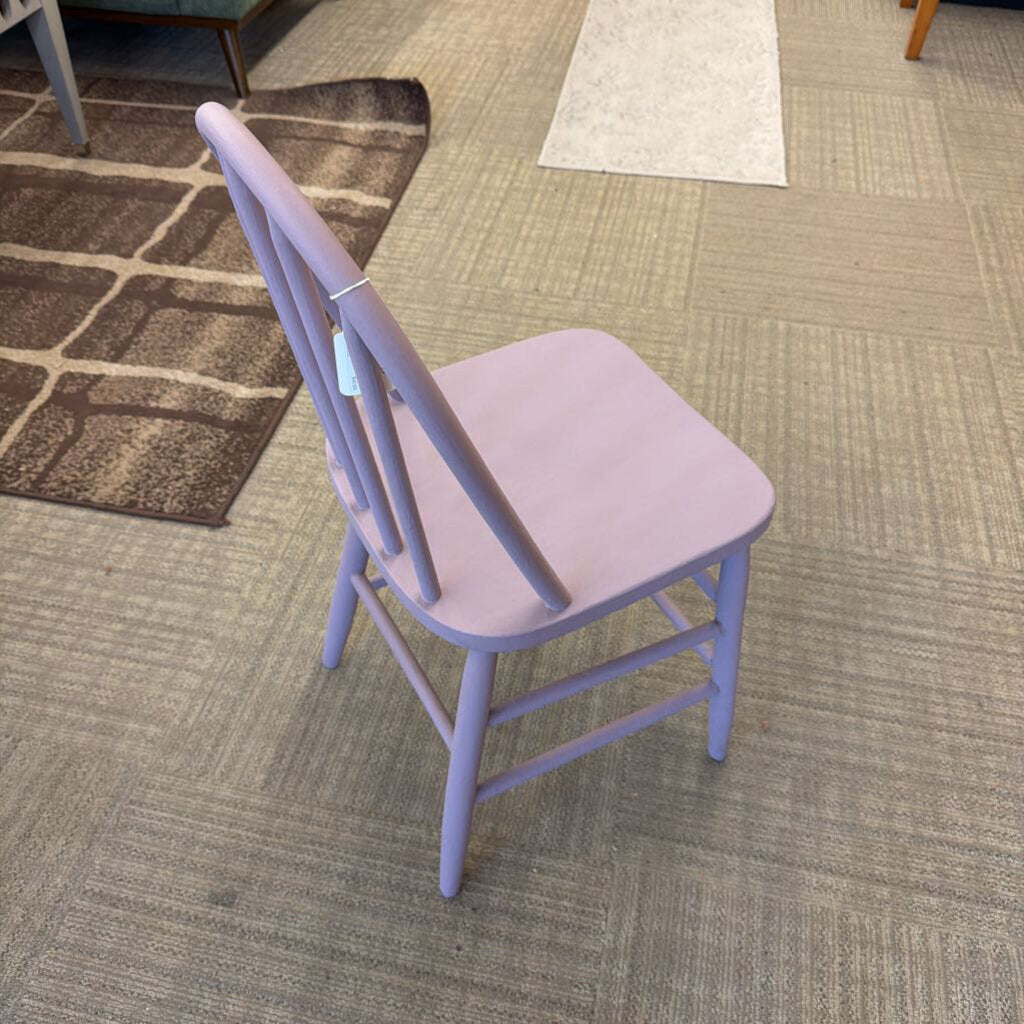 Purple chair on a carpeted floor