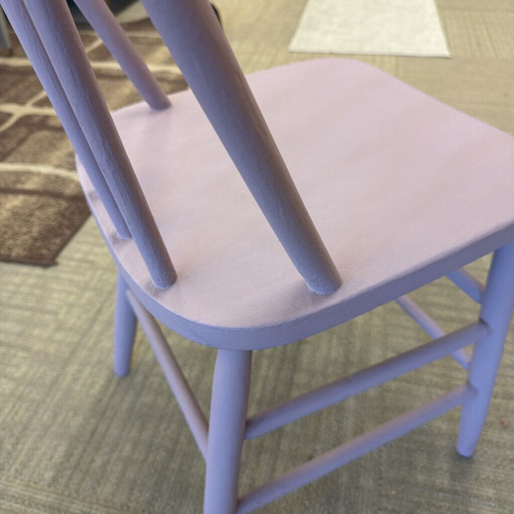 Purple chair on a carpeted floor