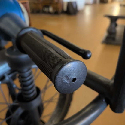 Close-up of a bicycle handlebar with blurred background