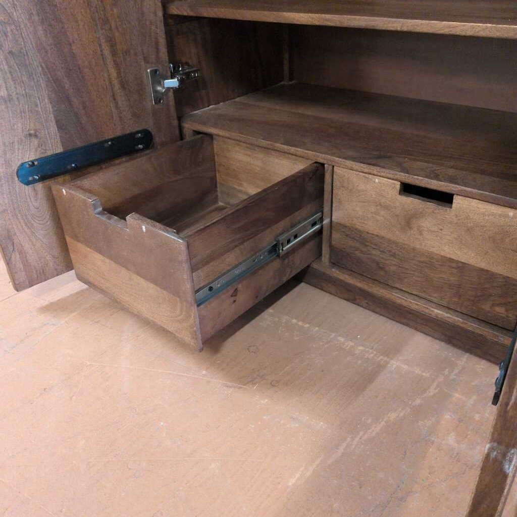 Wooden drawer being pulled out from a wooden cabinet.