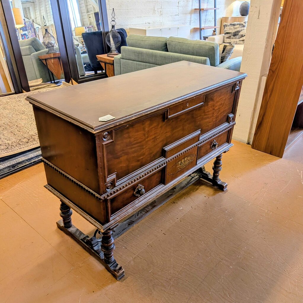 Wooden dresser in a room with furniture and decor