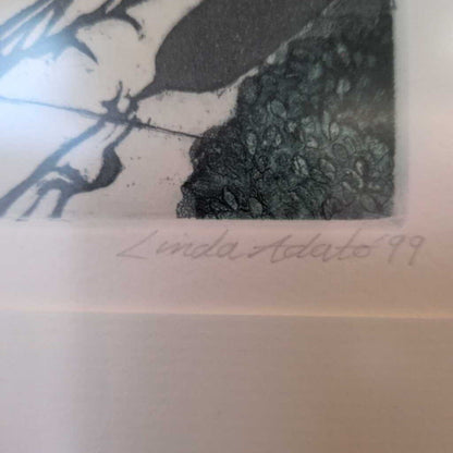 Artistic depiction of a figure with a textured background, signed 'Linda Addato 99'.
