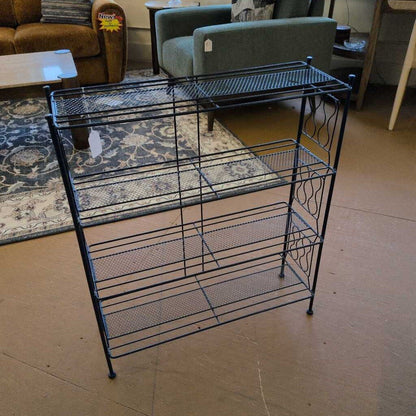 Black metal shelf with multiple tiers in a room setting