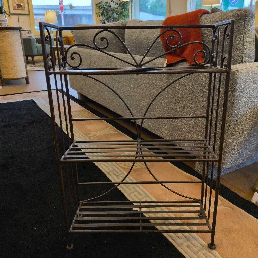 Wrought iron bookshelf in a living room setting