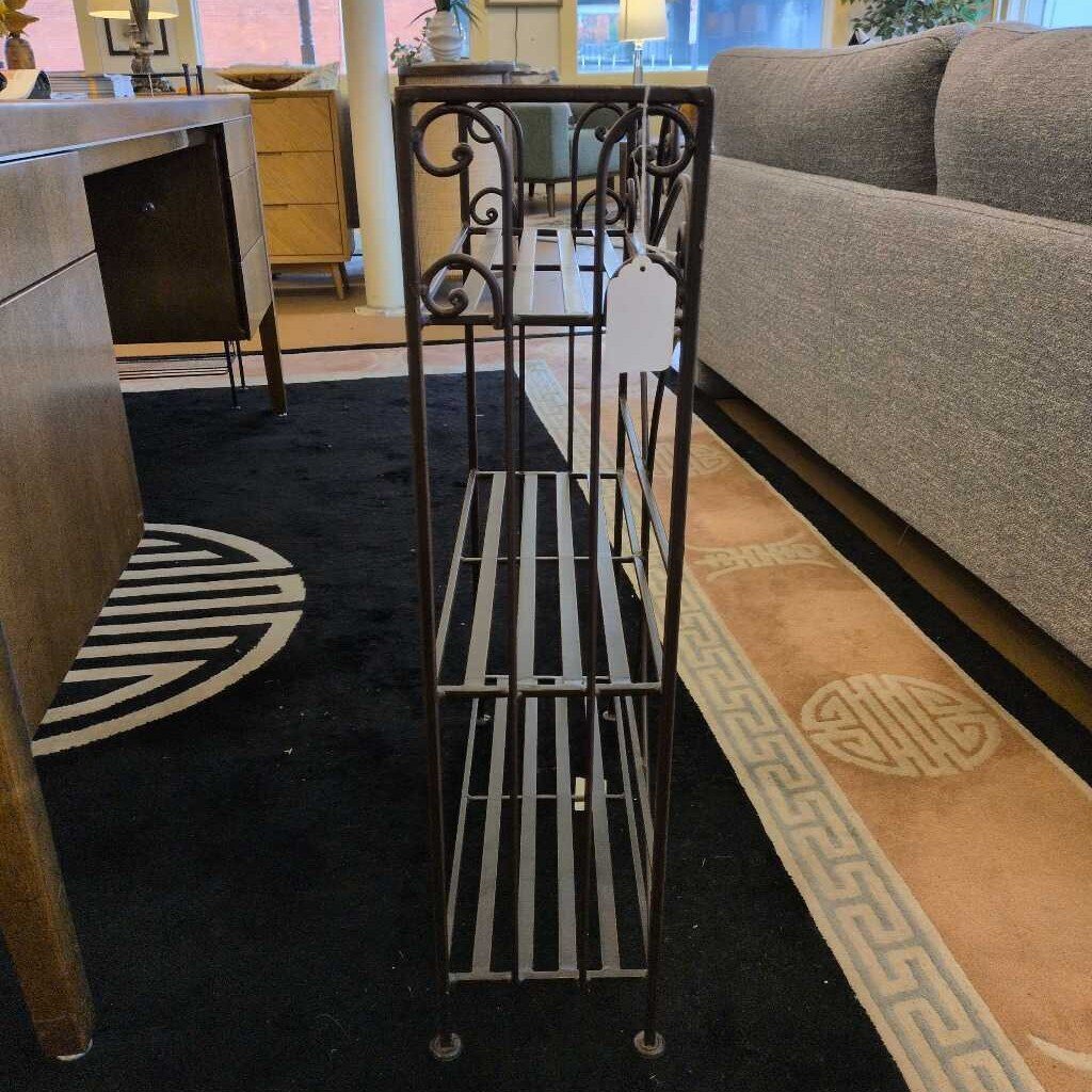 Metal rolling cart in a room with furniture and decor