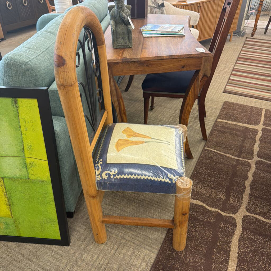 Wooden chair with a decorative cushion in a furniture store setting