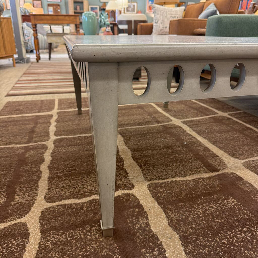 Table with decorative legs on a patterned carpet