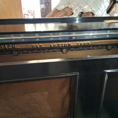 Close-up of a mechanical component with engraved text on a blurred background