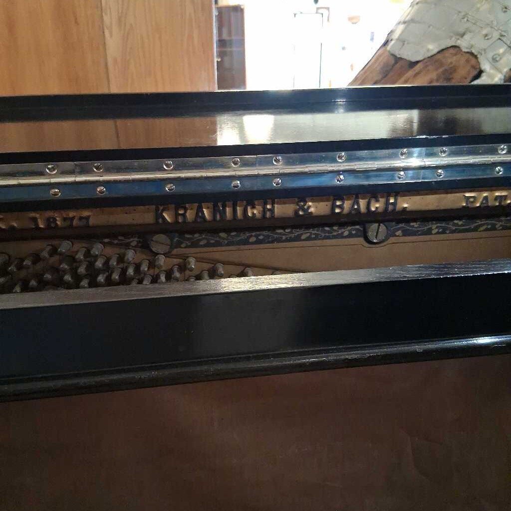 Metallic object with 'Krauss & Bauch' branding on a wooden surface