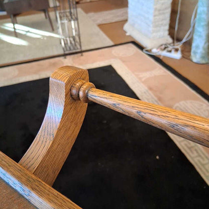 Wooden cart with wheels on a black floor
