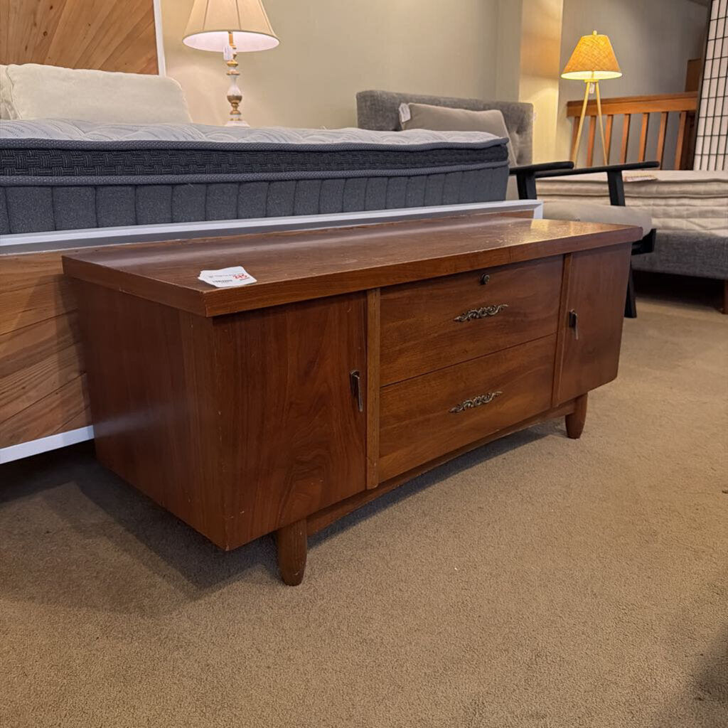 Wooden dresser with drawers in a room setting