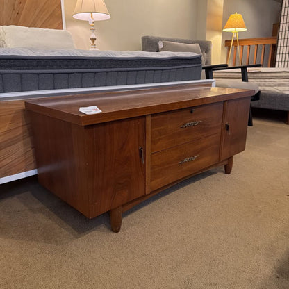 Wooden dresser with drawers in a room setting