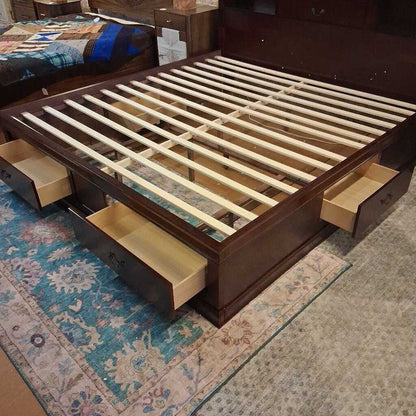 Wooden bed frame with storage drawers on a patterned rug