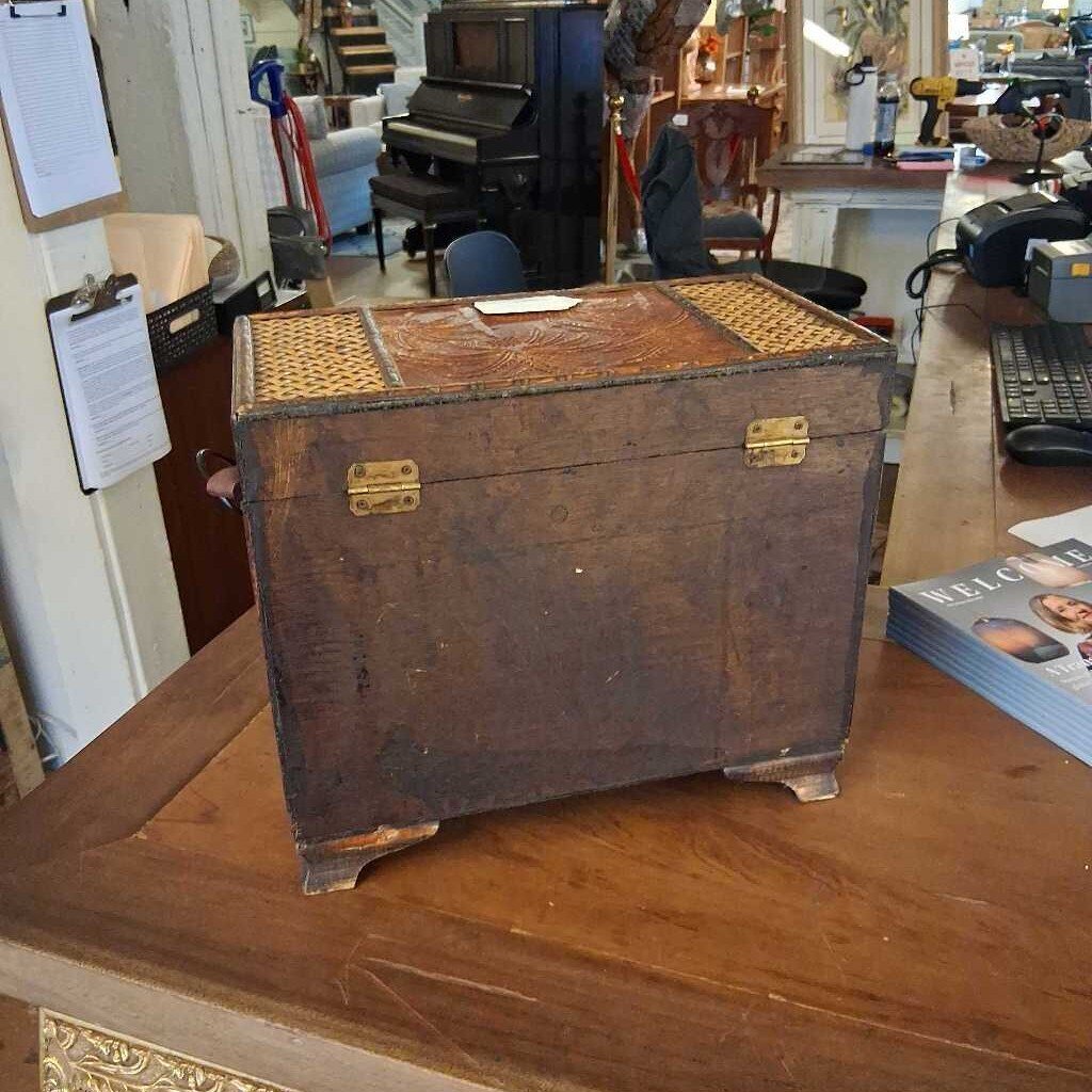 Vintage wooden trunk on a wooden surface with a room in the background